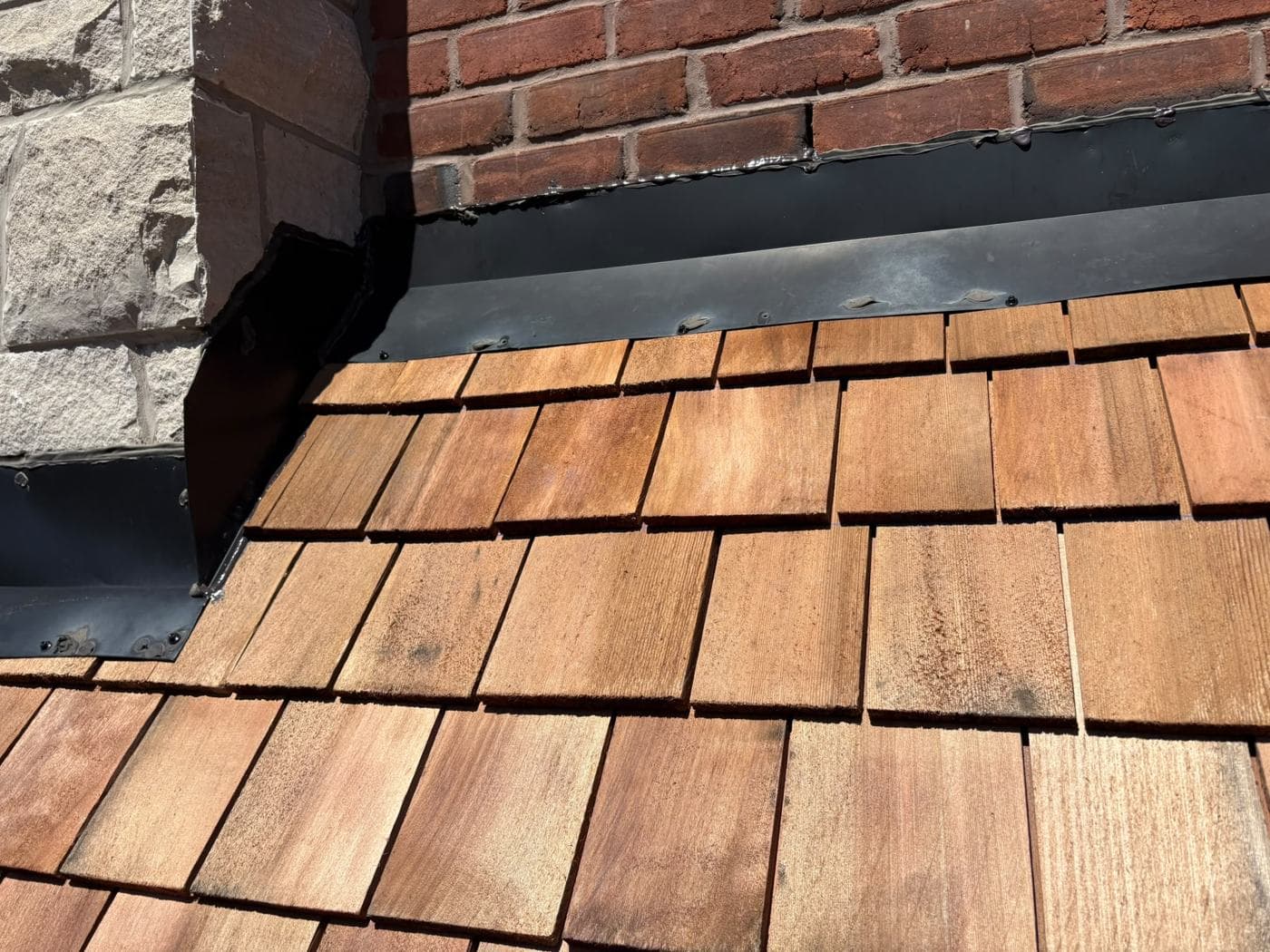 Flashing detail against a new cedar shake roof