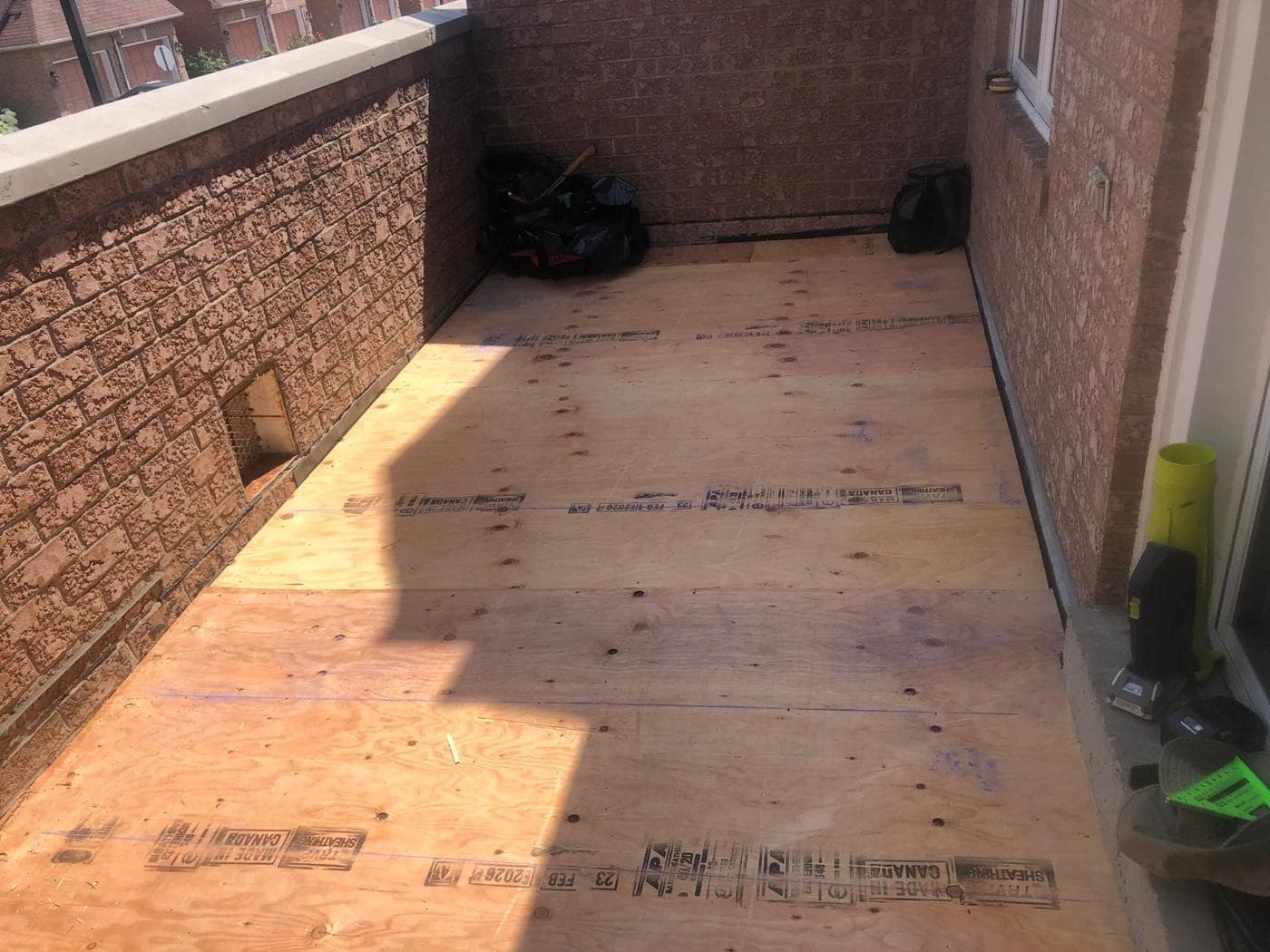 Bare plywood deck ready for a flat roof membrane